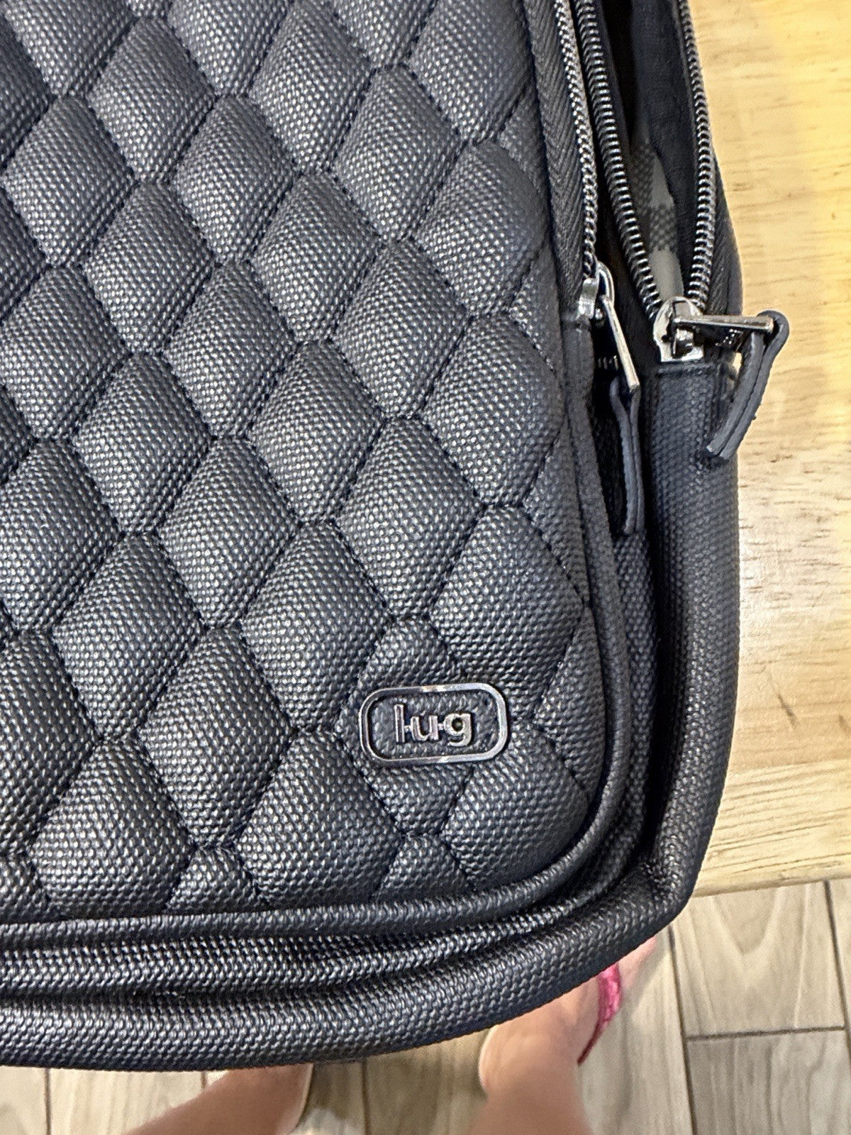 Compact Lug Sling Bag with Quilted Front Panel. Multiple Zip Pockets Black0