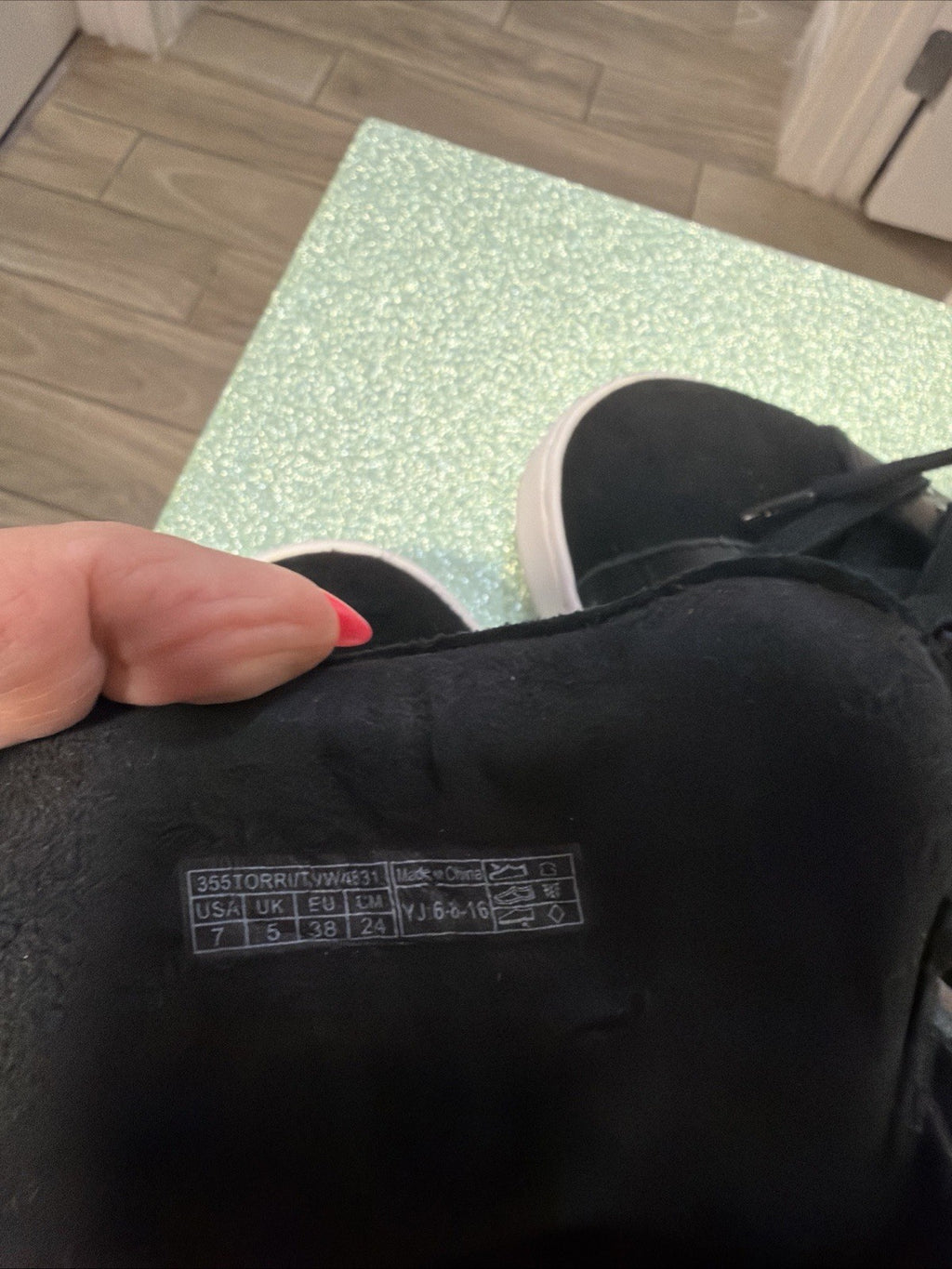 black hightop sneakers from Vionic featuring a side zipper and lace-up design.3