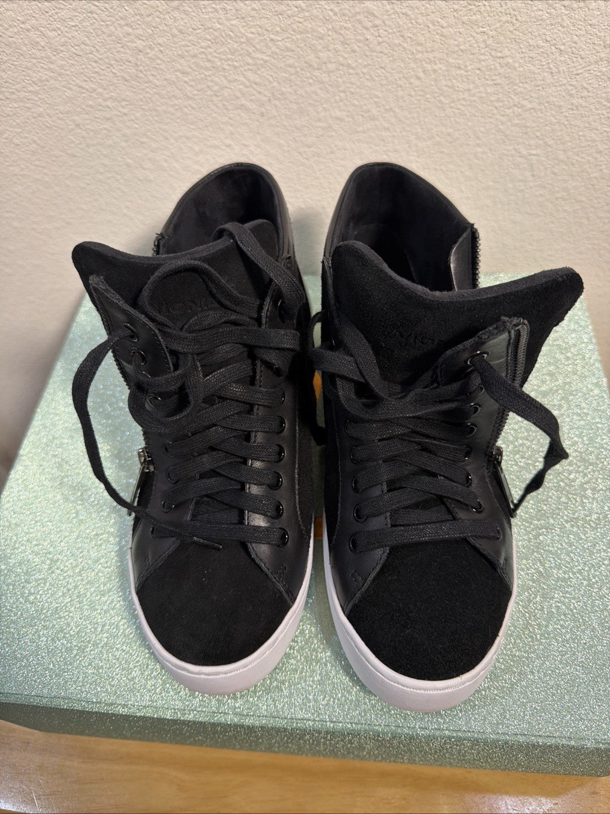 black hightop sneakers from Vionic featuring a side zipper and lace-up design.1
